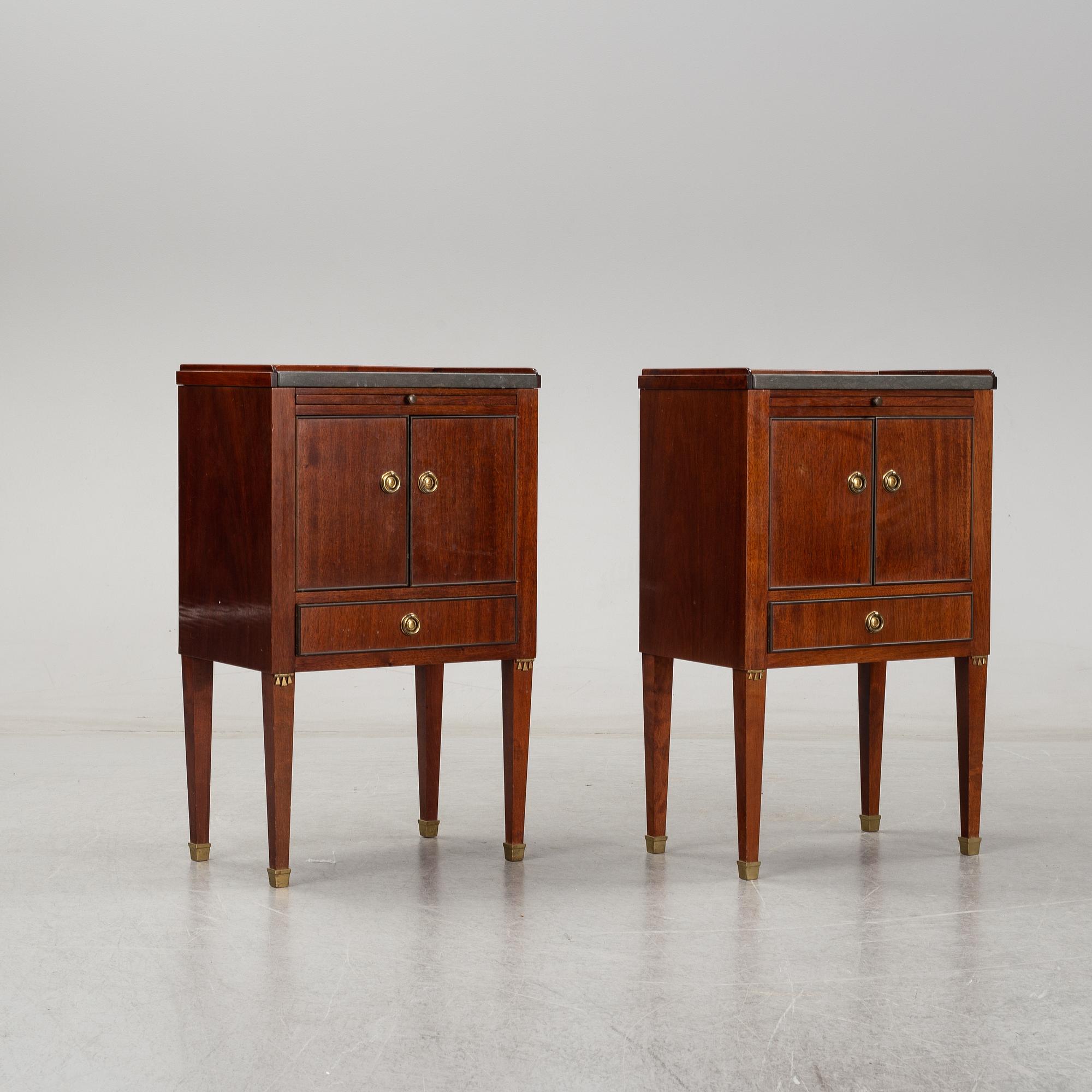 A pair of mahgany veneered bedside cabinets, early 20th Century.