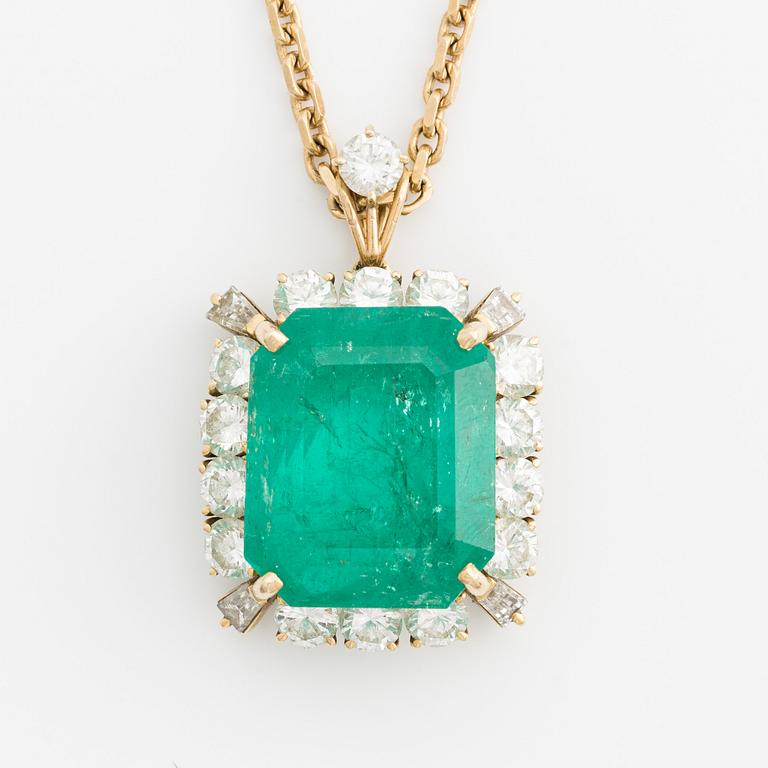 Pendant, with emerald-cut emerald and trapeze- and brilliant-cut diamonds, with chain.