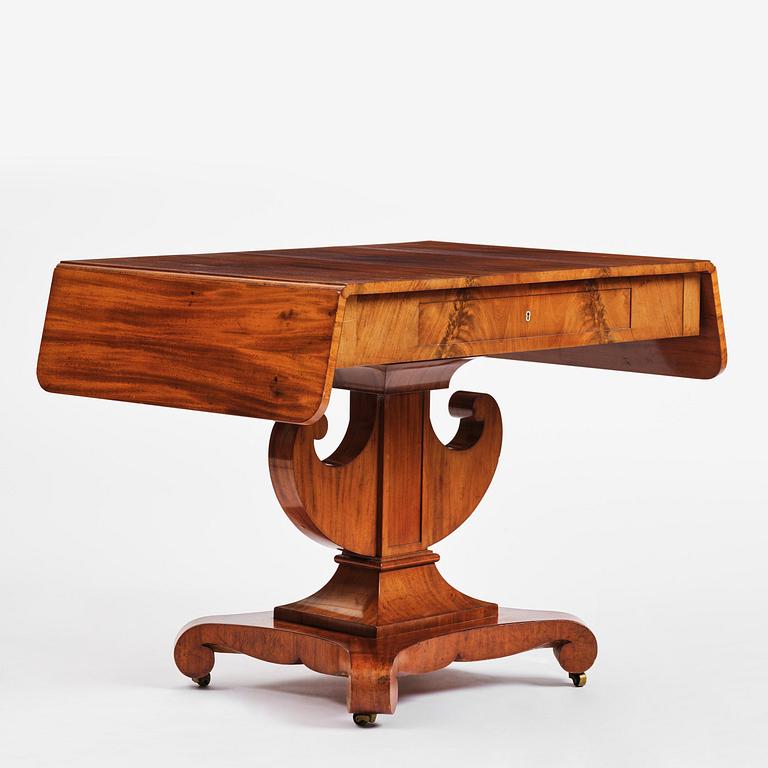 A Swedish Empire mahogany center table.
