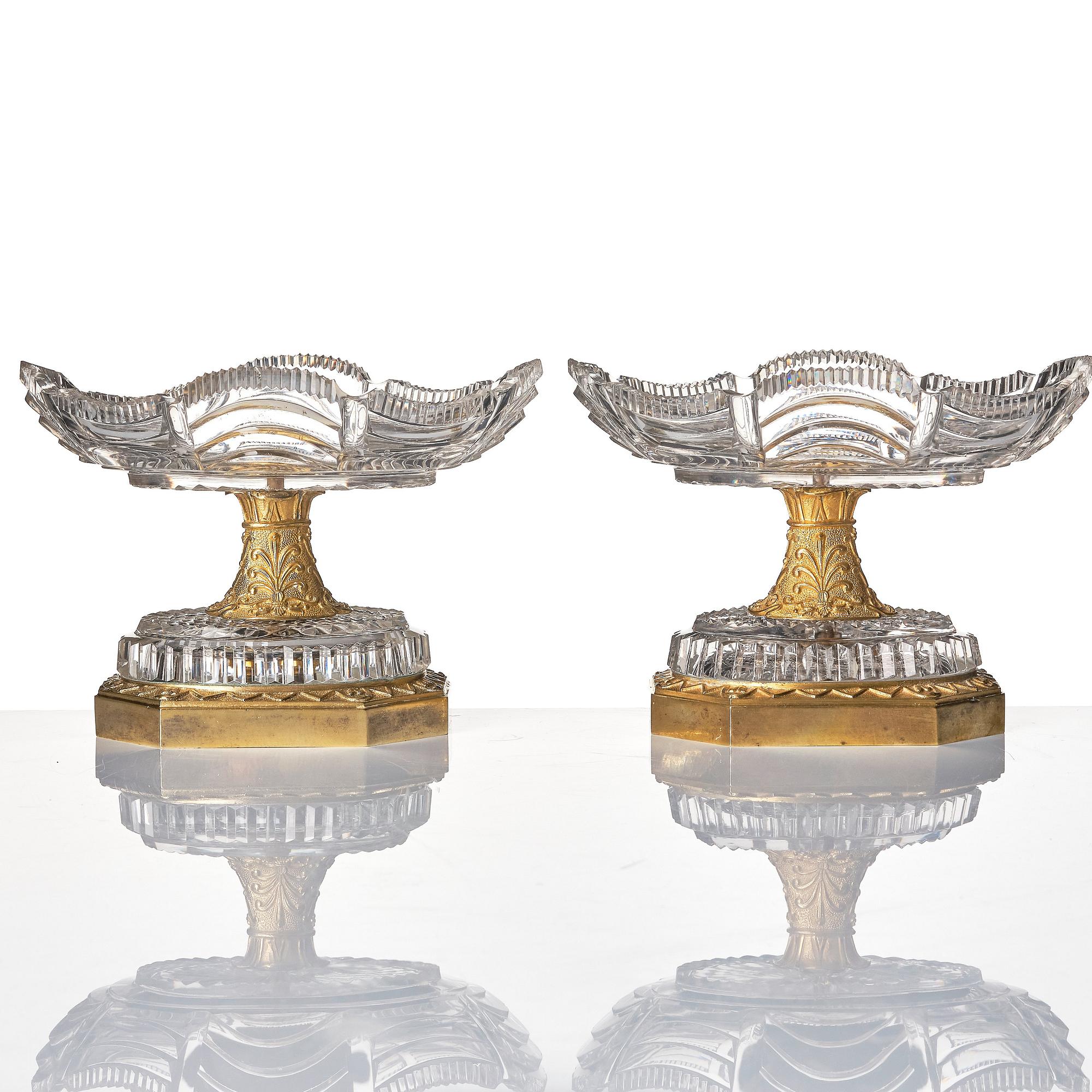 A pair of French Empire early 19th century gilt bronze and glass centre pieces.