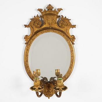 A pair of French Louis XIV-style ormolu two-light girandoles, after a model by Daniel Marot (1661-1752).
