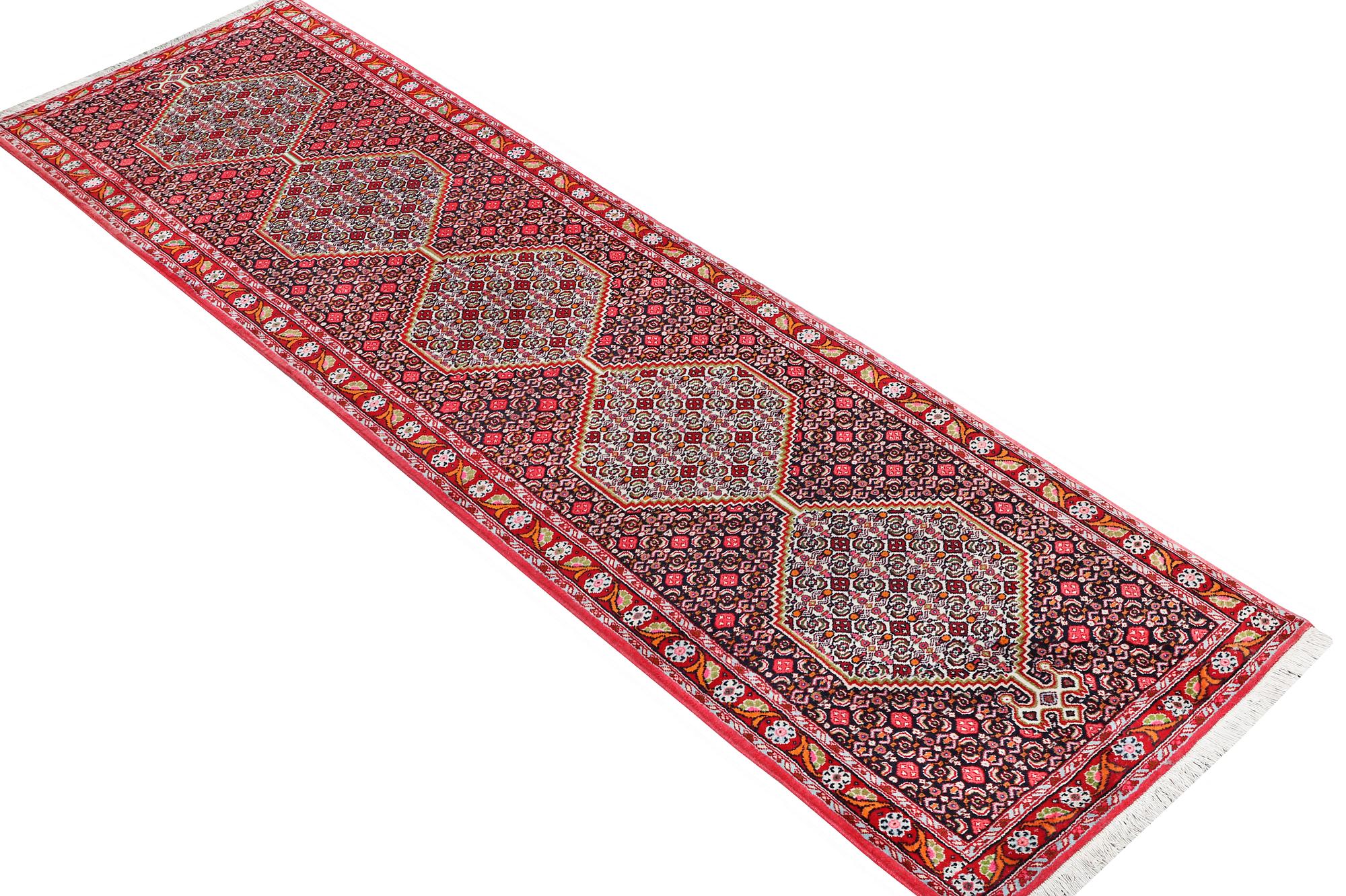 A Runner carpet, Senneh, c. 325 x 80 cm.