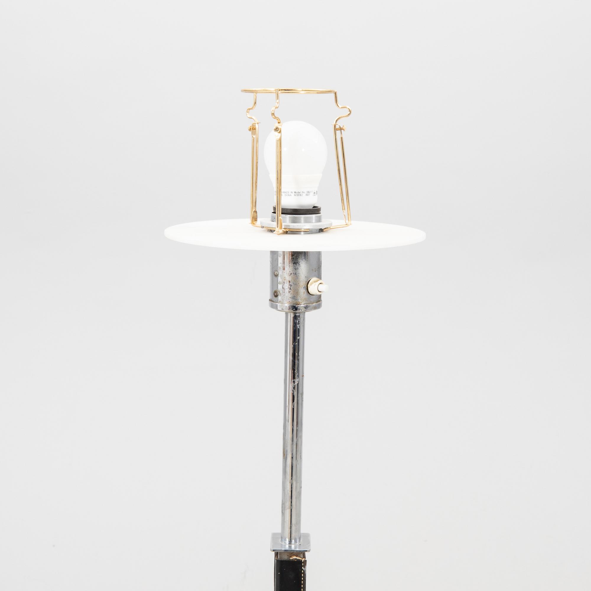 A Philips leather and chrome floor lamp model no 590A later part of the 20th century.