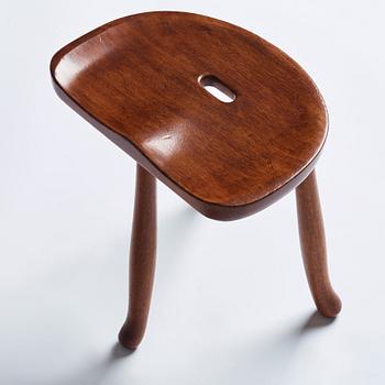 Josef Frank, a three legged mahogany stool, model 336, Svenskt Tenn, Sweden 1940-1950s.