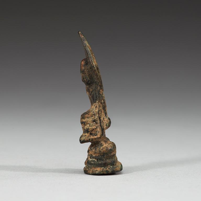 A miniature bronze figure of a enthroned seated Bodhisattva, presumably Tang dynasty (618-907).