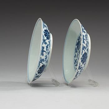 A pair of blue and white lotus dishes, Qing dynasty with Qianlong seal mark.