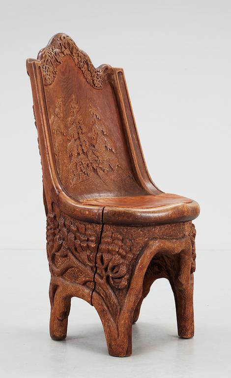 A Gustaf Fjaestad Art Nouveau sculptured pine chair, Sweden circa 1900.