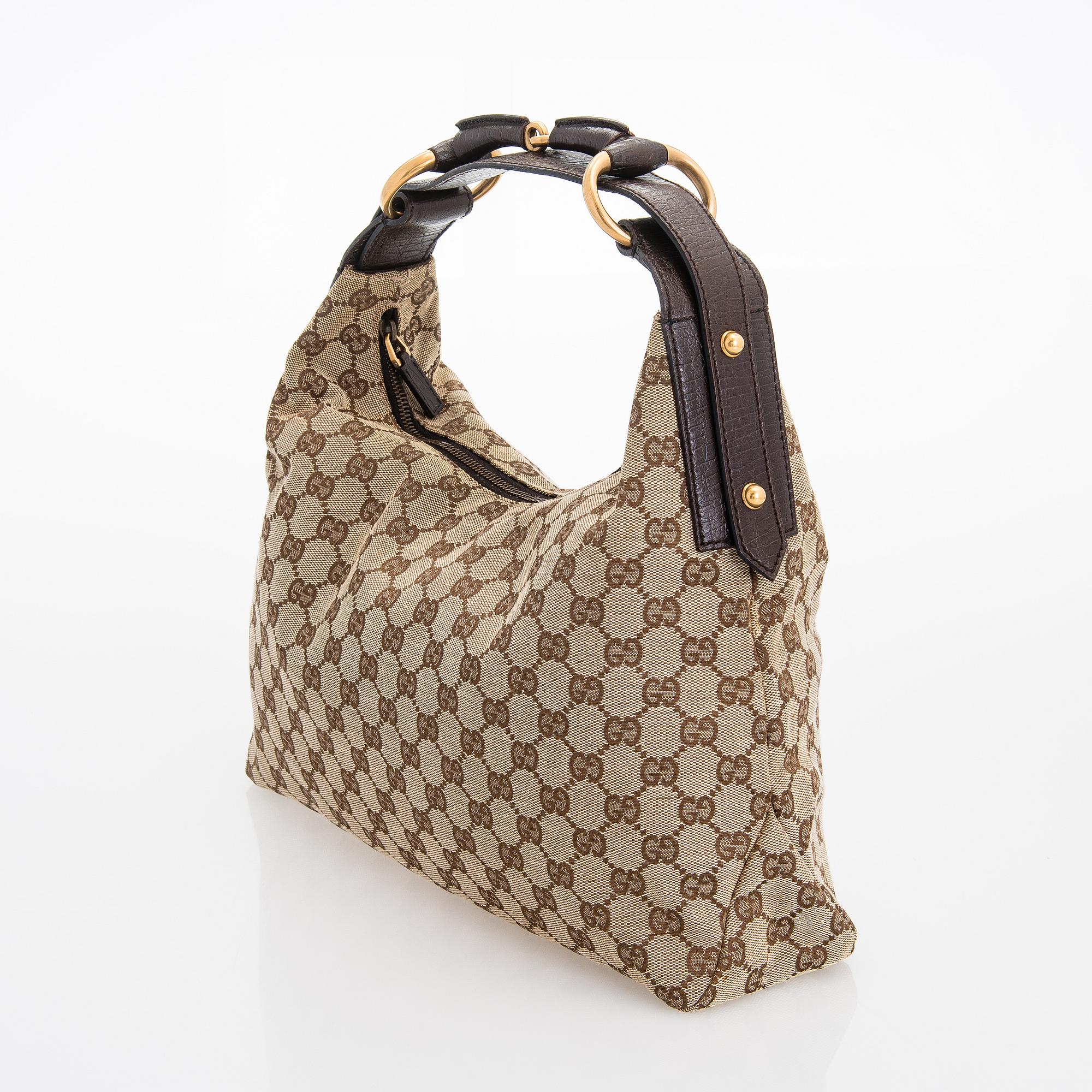 Gucci, a 'Horsebit GG Canvas Hobo Bag'.