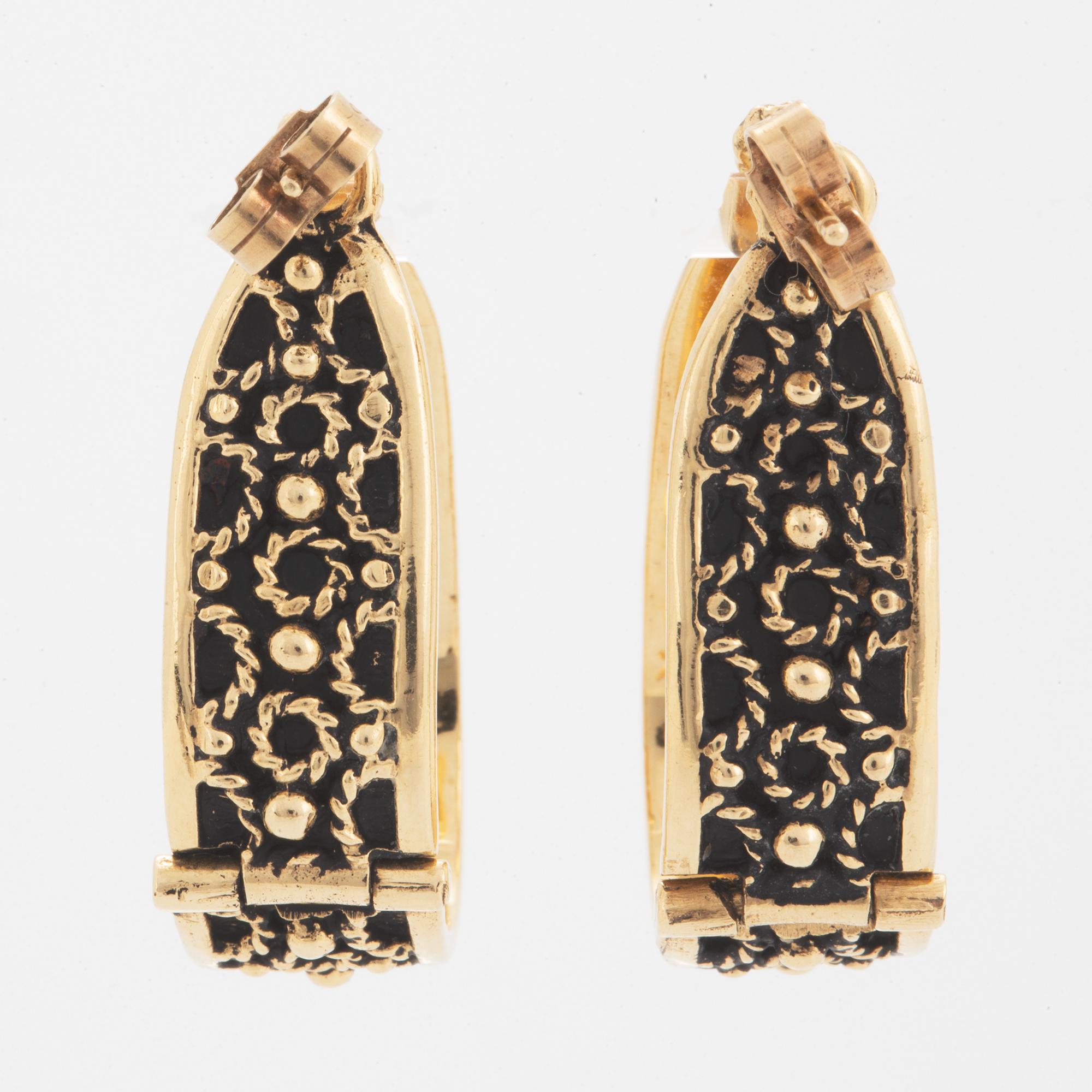 14K gold hoop earrings.