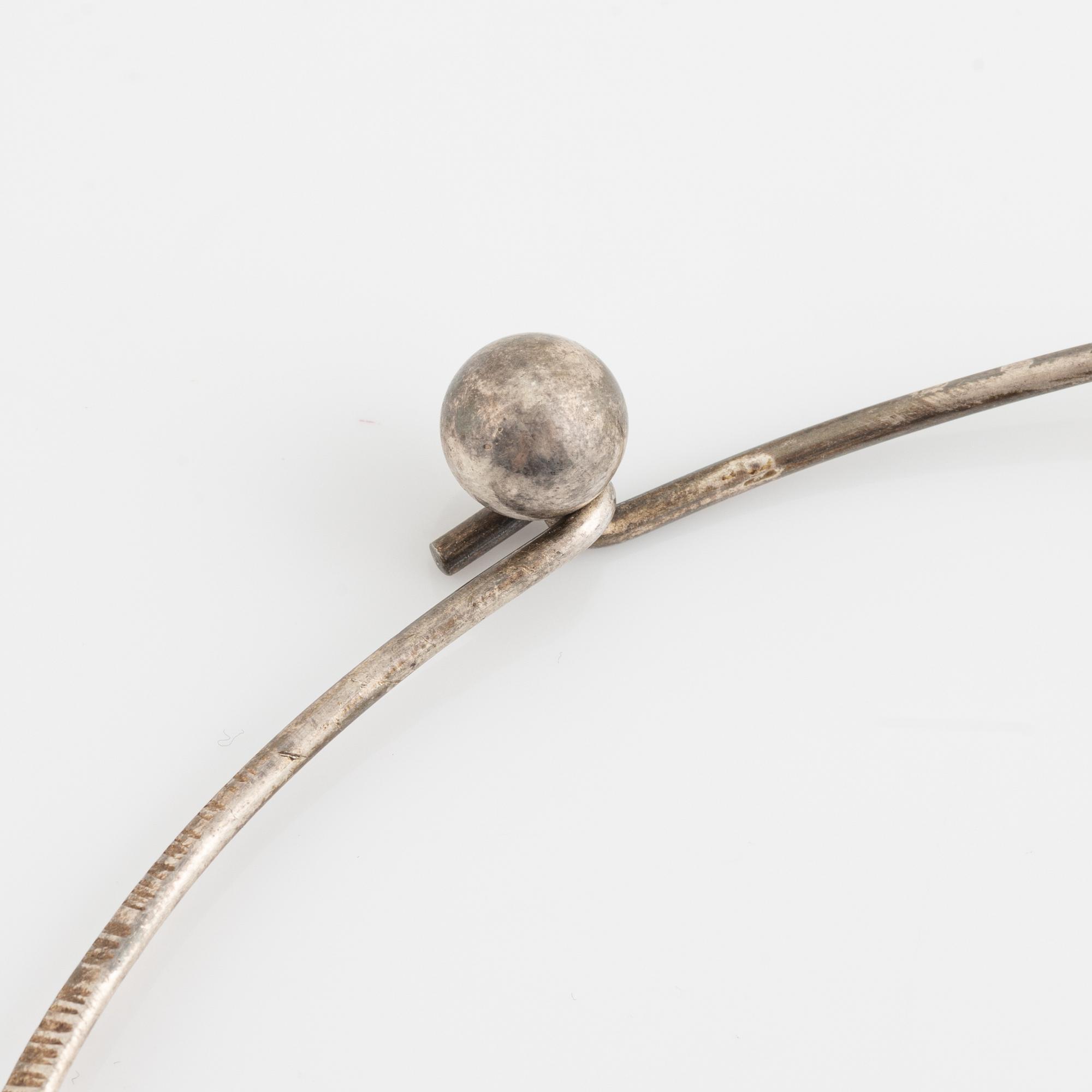 Silver necklace with pendant.