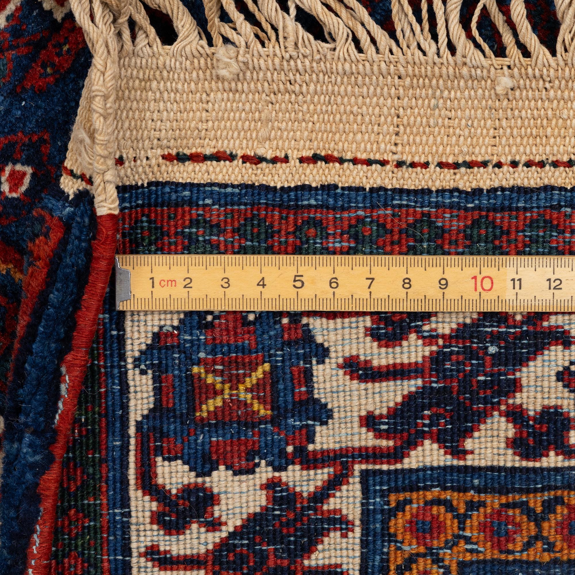 An oriental carpet, c. 360 x 270 cm.