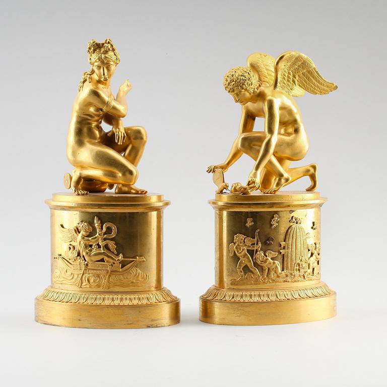 A pair of early 19th century Empire gilt bronze table sculptures.