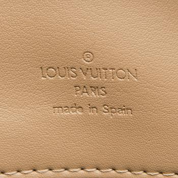 A Monogram Vernis Houston Bag.