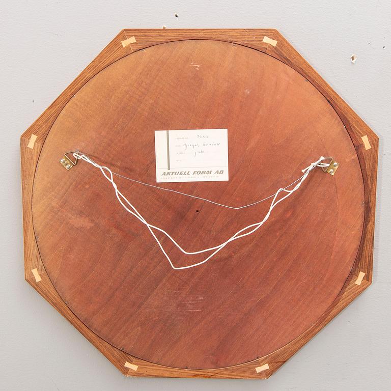 A Sigvard Bernadotte jacaranda mirror for Aktuell Form later part of the 20th century.