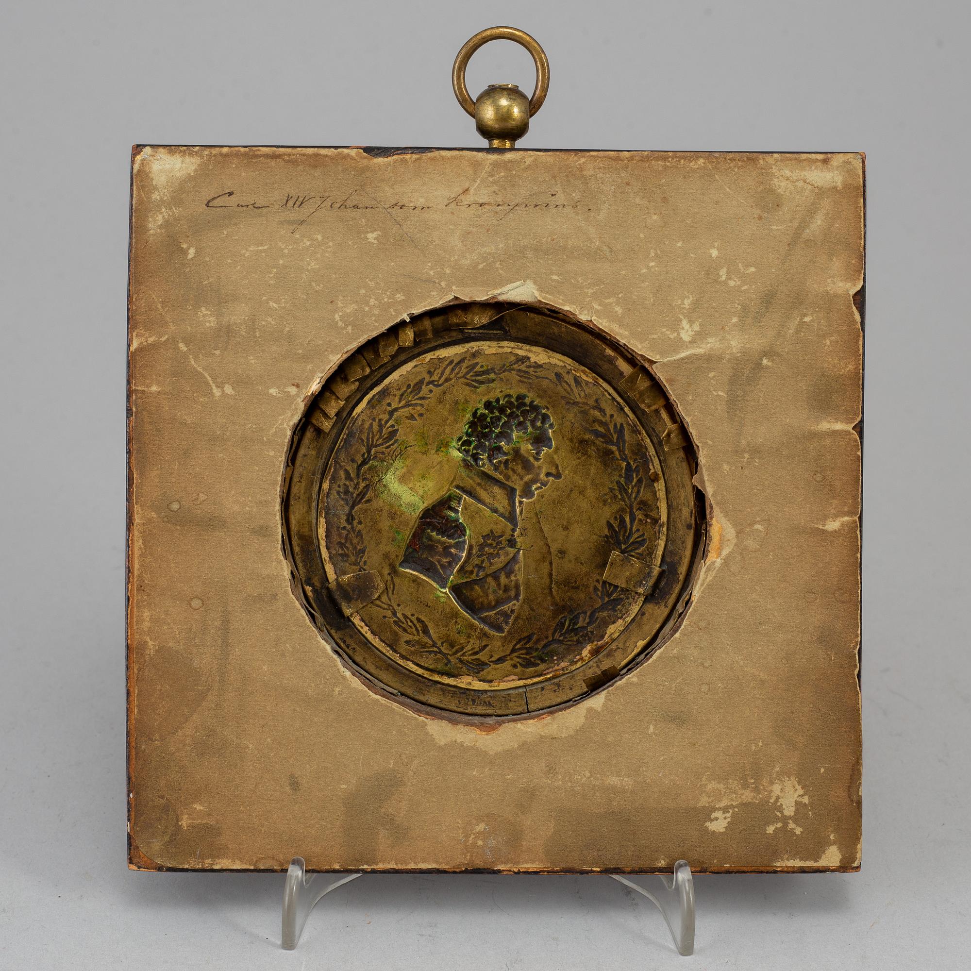 A gilt brass medalion, early 19th century.