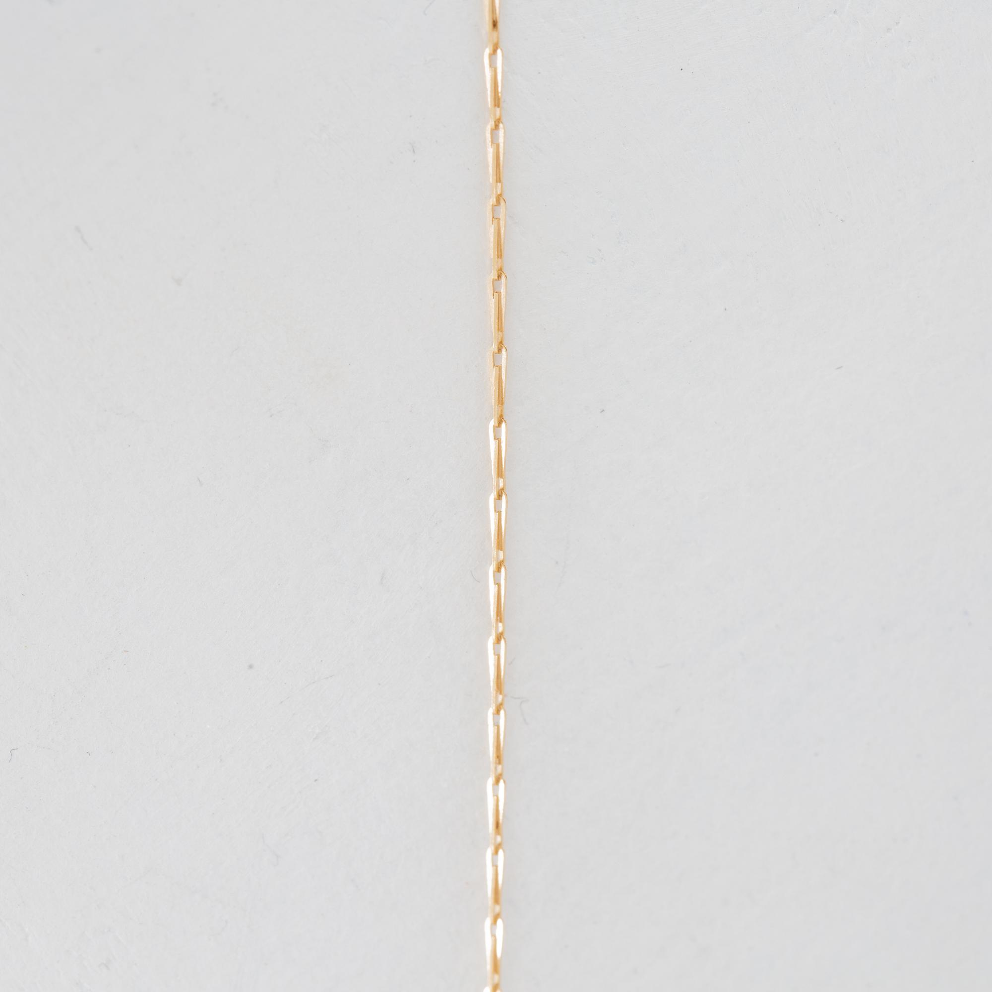 Necklace of 14K and 18K gold with a cultured pearl.