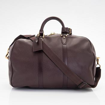 Louis Vuitton, a 'Taiga Kendall PM' weekend bag.