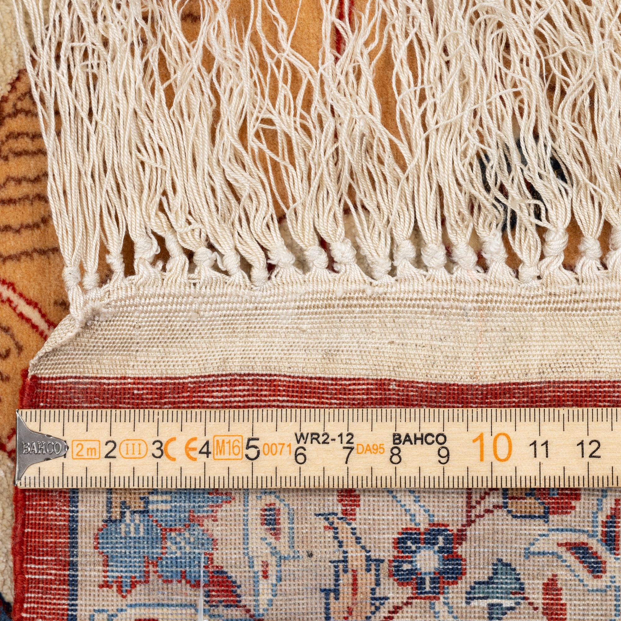 A semi-antique rug, Central Persia, signed (Hosien) Seirafian, c. 166 x 117 cm.