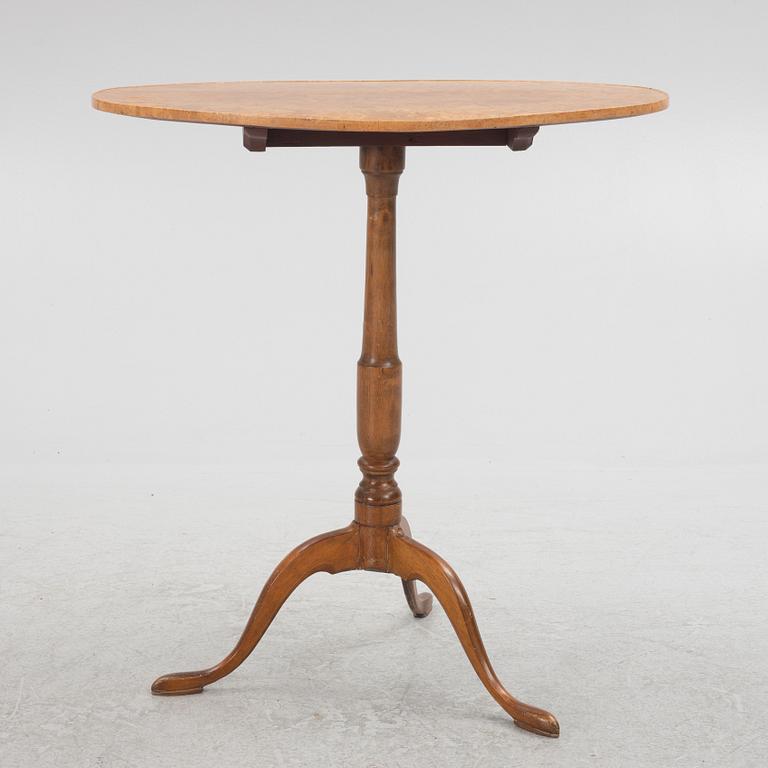 A 19th Century birch tilt top table.