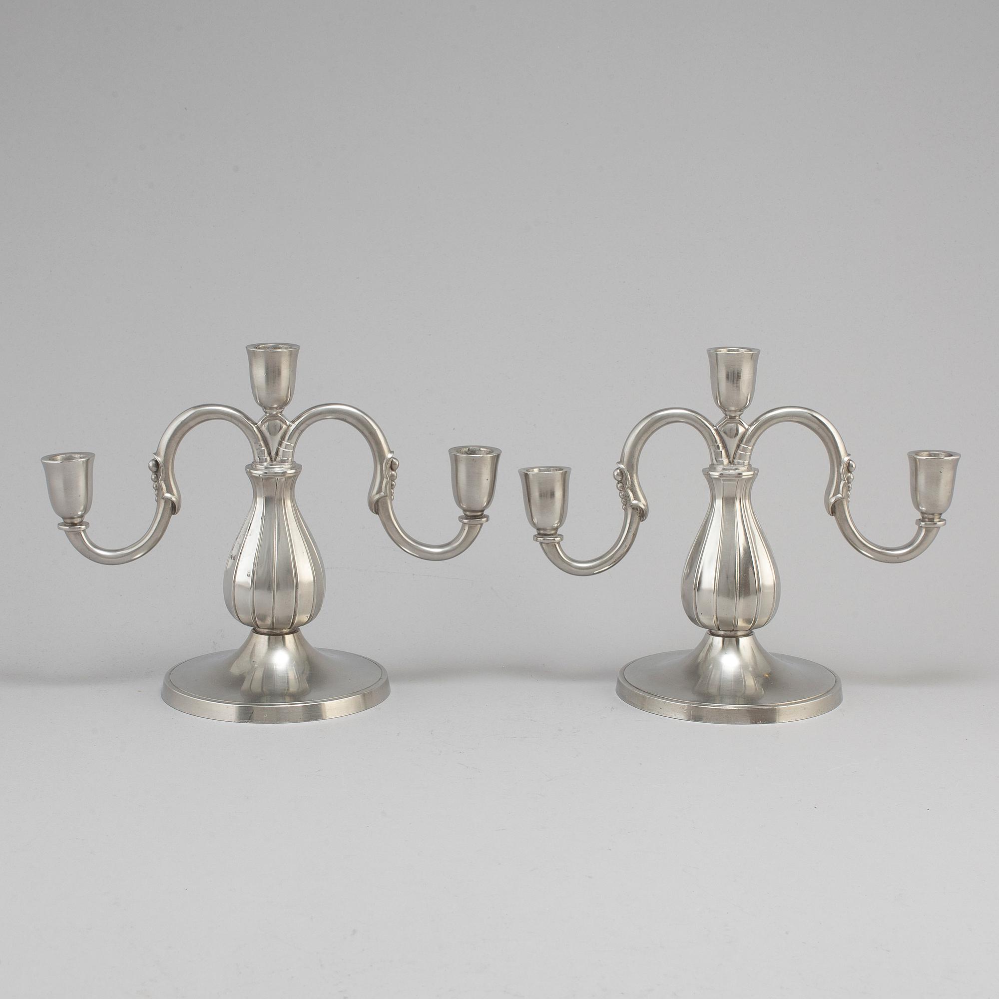 A pair of pewter candelabra from GAB Tenn, Stockholm, 1935.