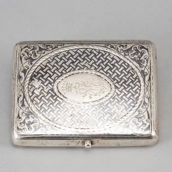 A Russian parcel-gilt silver and niello cigarette-case, import marks 1882-98.