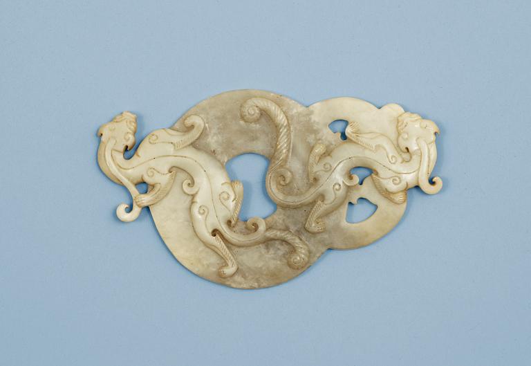 A carved archaistic nephrite placque, presumably Qing dynasty.
