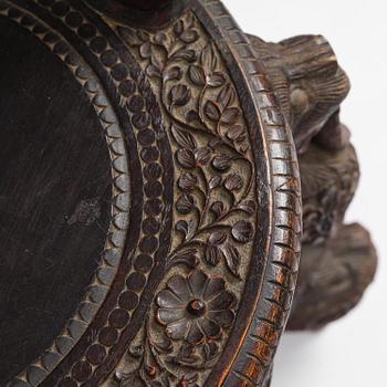 A pair of carved 'blackwood' armchairs, Bombay presidency, British Raj, circa 1880.