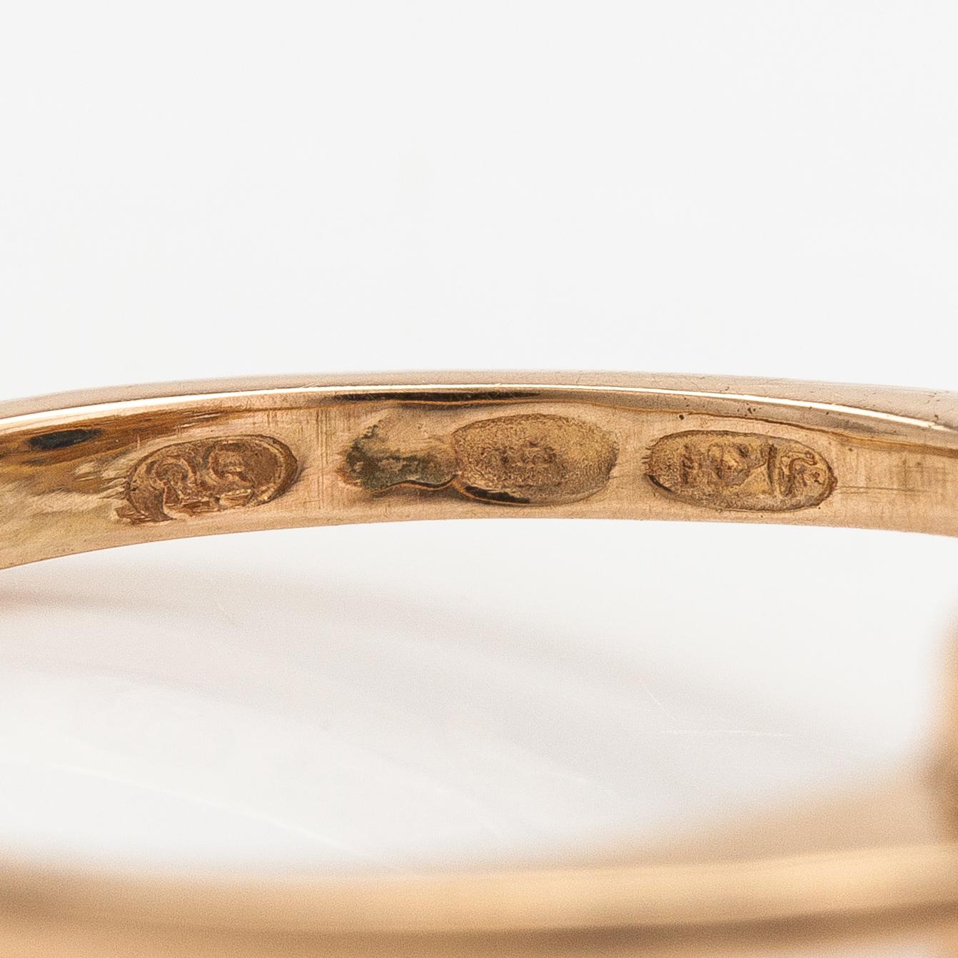 A 14K gold ring with diamonds ca. 0.40 ct in total and a sapphire. Finland 1995.