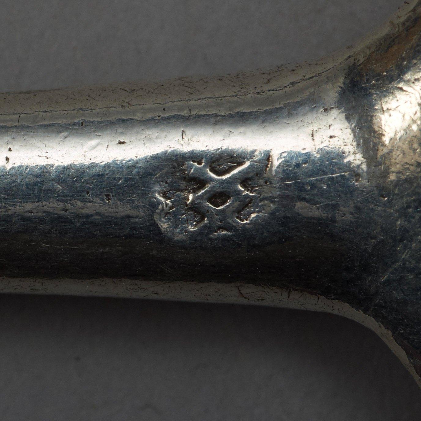 An English early 18th century silver spoon, possibly.