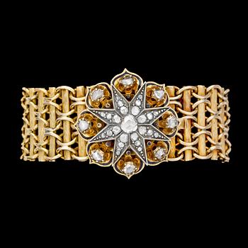 950. ARMBAND, guld med ornament med rosenslipade diamanter samt svart emaljarbete, 1800-talets andra hälft.
