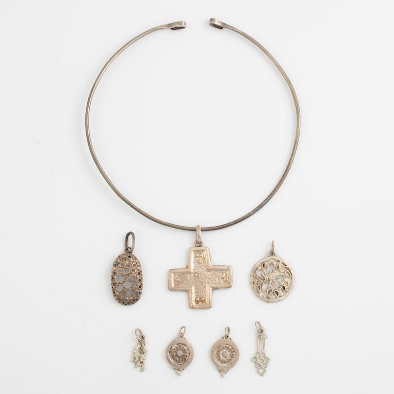 Lars Arby, a neck ring and seven pendants, silver, Gothenburg 1966, 1977 and 1982.