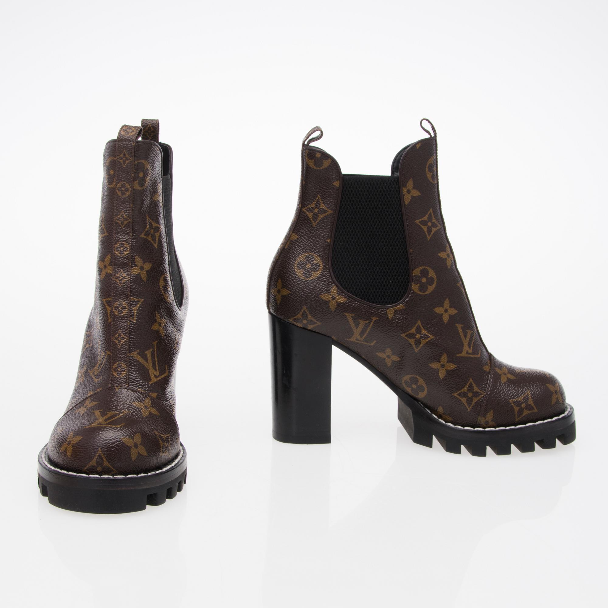 A Monogram Canvas Star Trail Ankle Booties size 37. Bukowskis