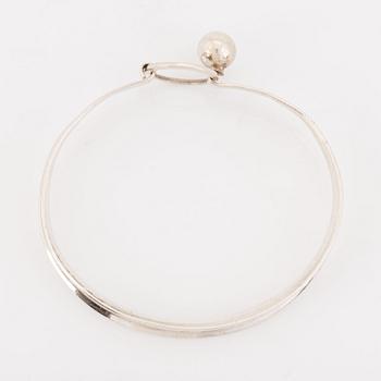 A silver Erik Granit bracelet.