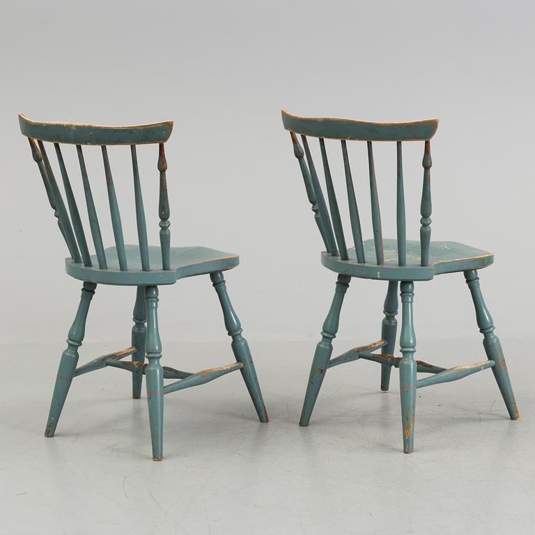 A pair of late 19th century painted chairs.