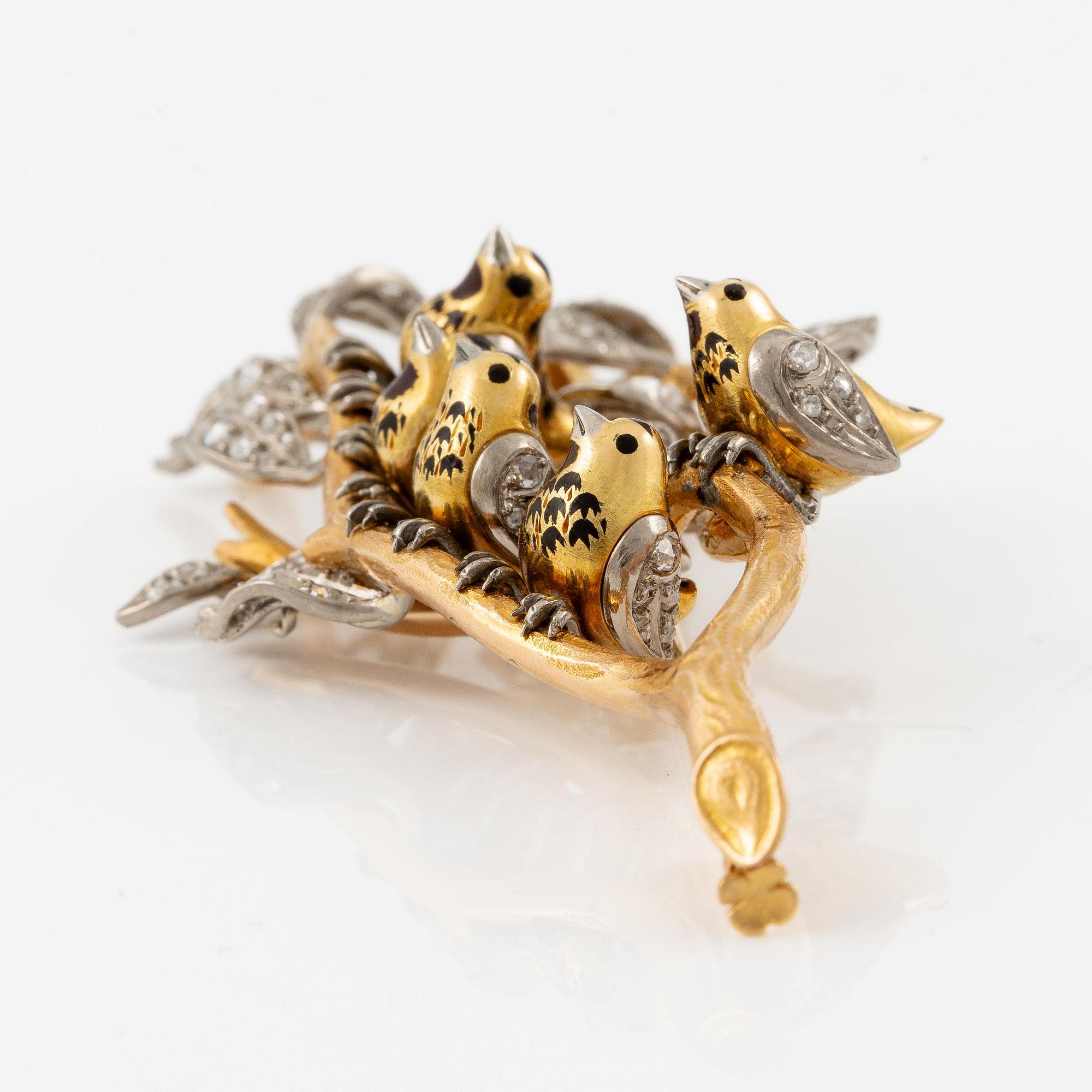 A W.A. Bolin brooch in 18K gold with enamel details and rose-cut diamonds.
