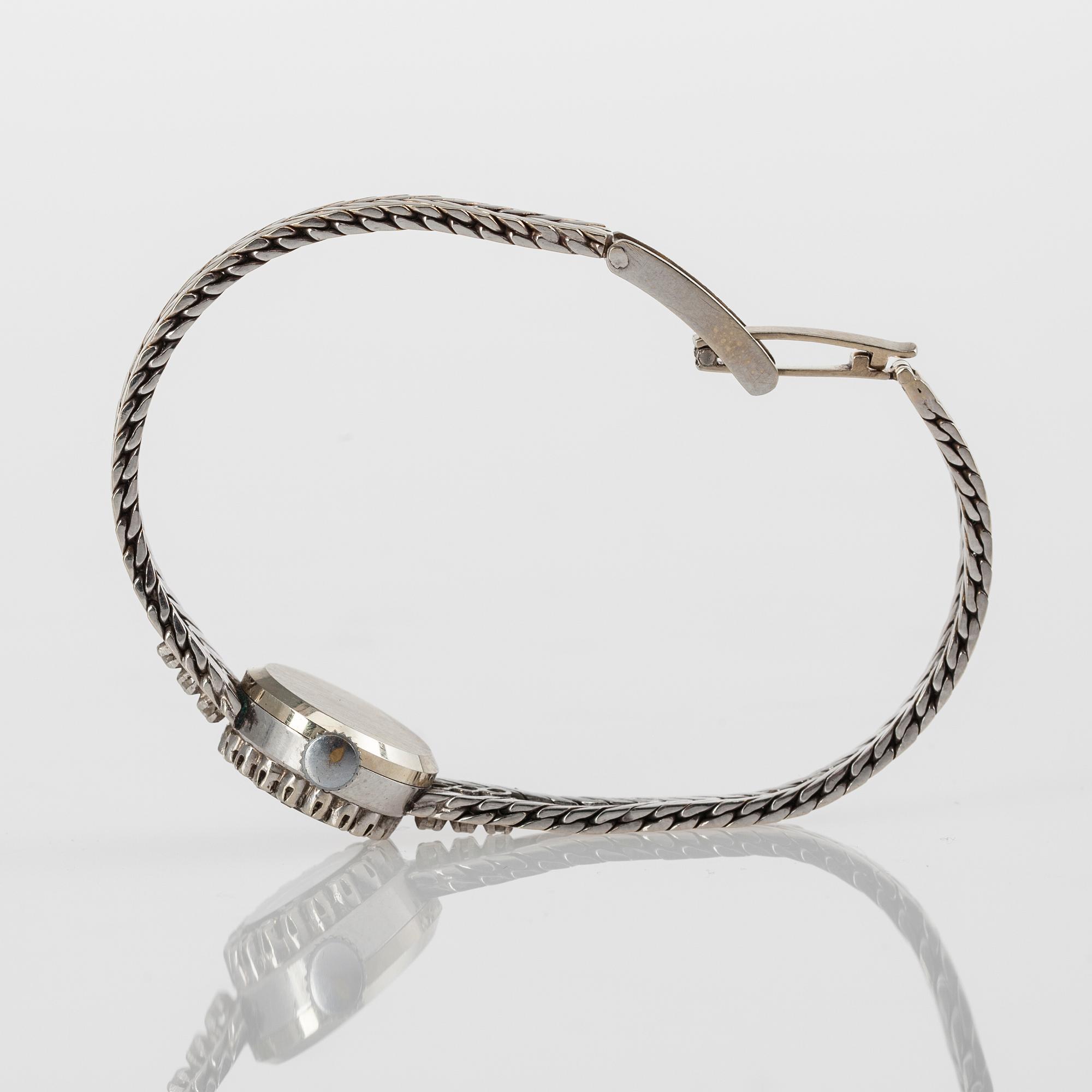 DAMARMBANDSUR, Monvis, 18K guld, 25 åttkantslipade diamanter, 1900-talets andra hälft. Vikt 20 g.