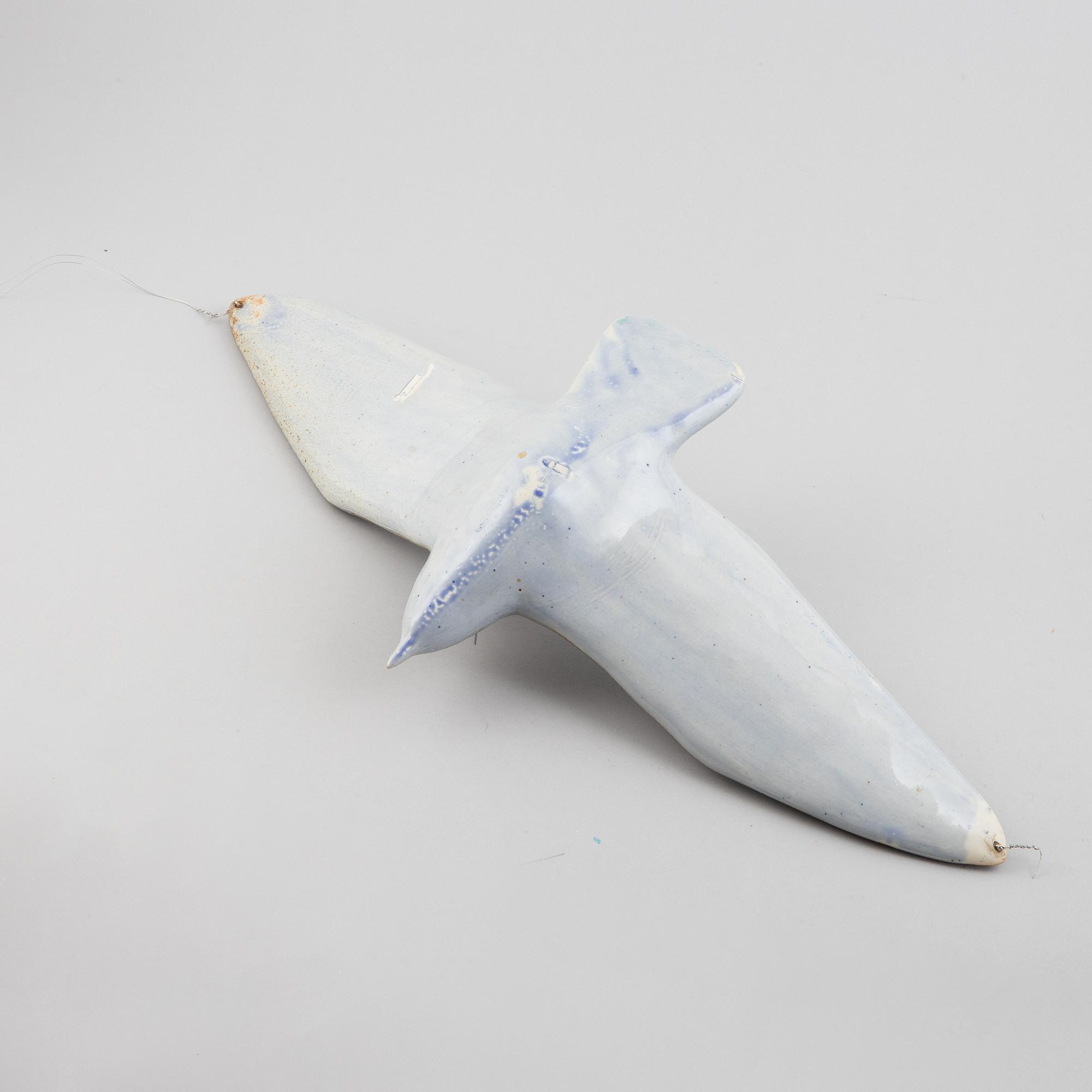 A stoneware sculpture of a sea bird, unsigned.