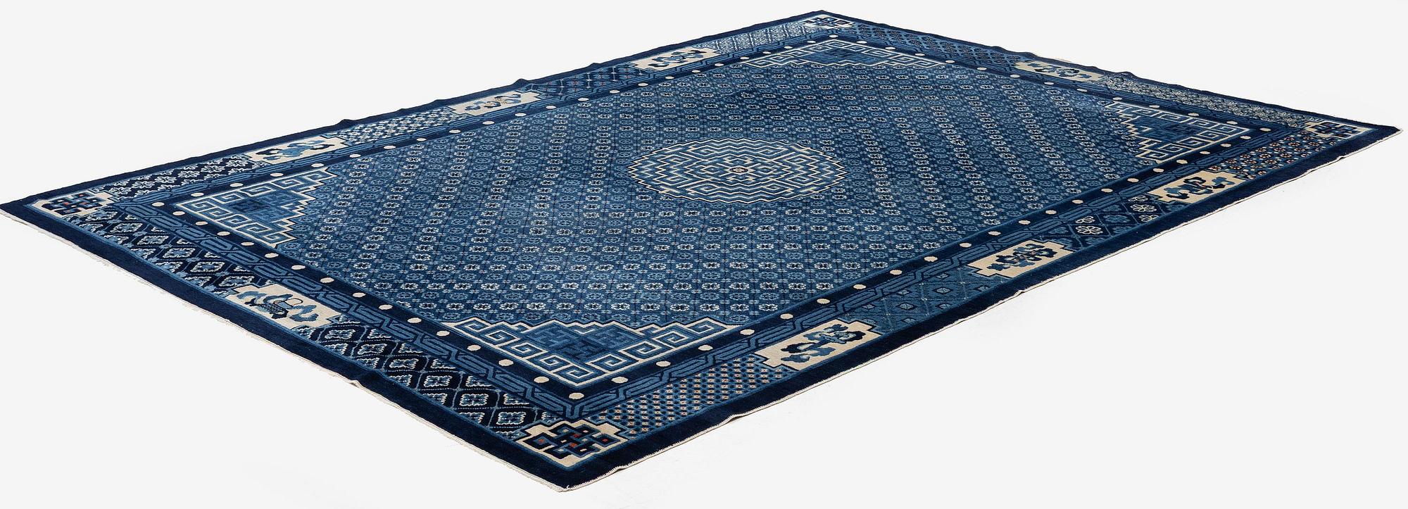 A semi-antique Baotou carpet, West China, c. 335 x 246 cm.
