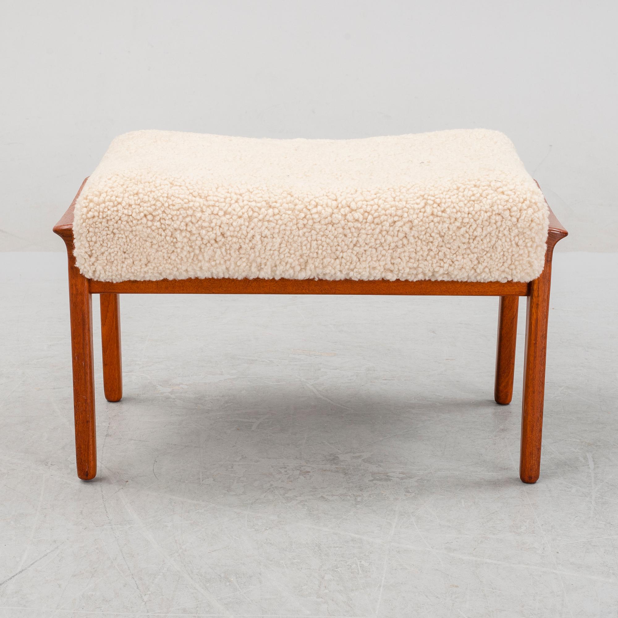 A Danish mid 20th Century sheepskin upholstered ottoman.