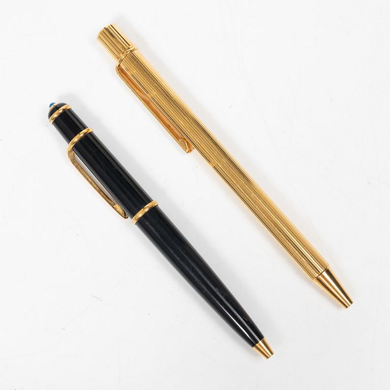 Cartier, Two ballpoint pens, 'must de Cartier' and 'Diabolo de Cartier'.