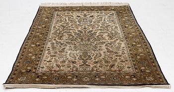 A Ghom, silk rug, c. 215 x 140 cm.