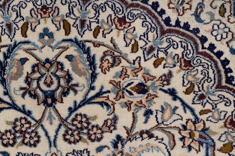 A Nain carpet, c. 310 x 195 cm.