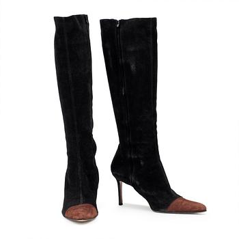 563. CHRISTIAN DIOR, a pair of black suede boots.
