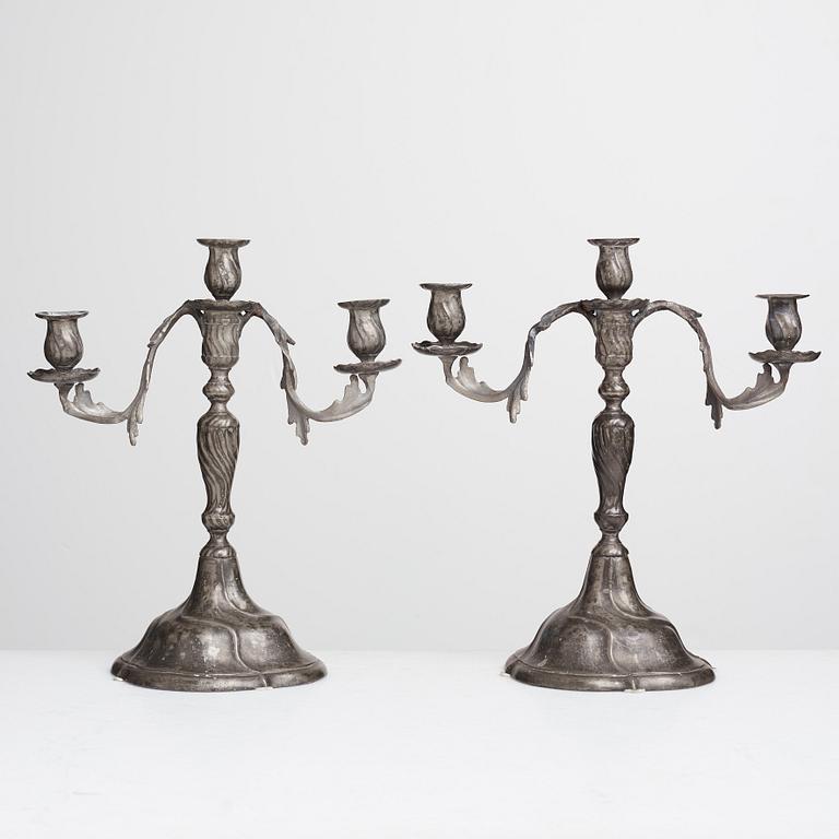 A pair of Swedish Rococo pewter three-light candelabra by Anders Wetterquist, Stockholm 1774.