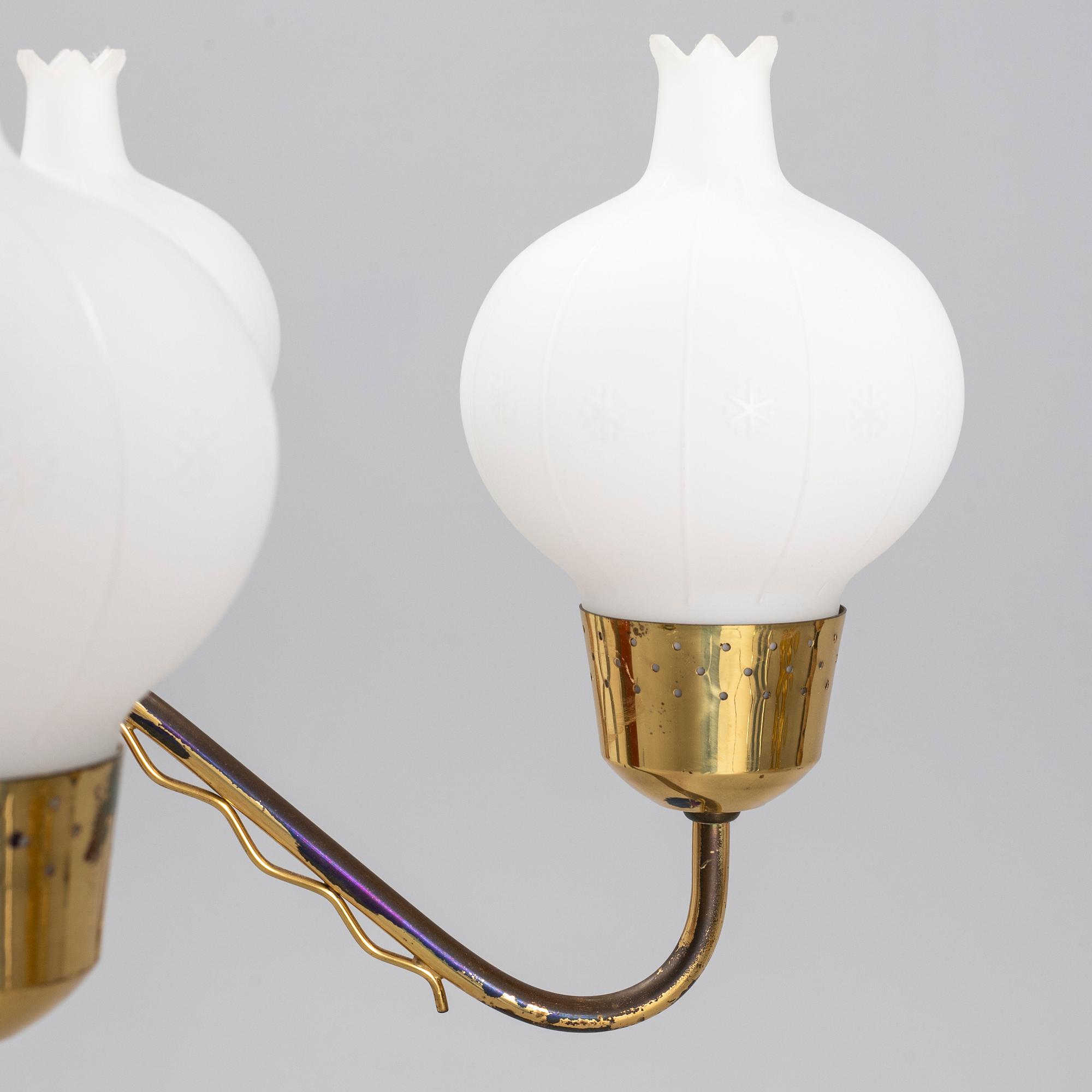 A 1950's glass and brass ceiling light.