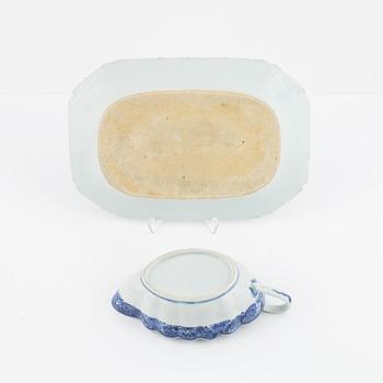 A blue and white porcelain charger, three plates and a sauce snipe, Qing dynasty, Qianlong (1736-95).