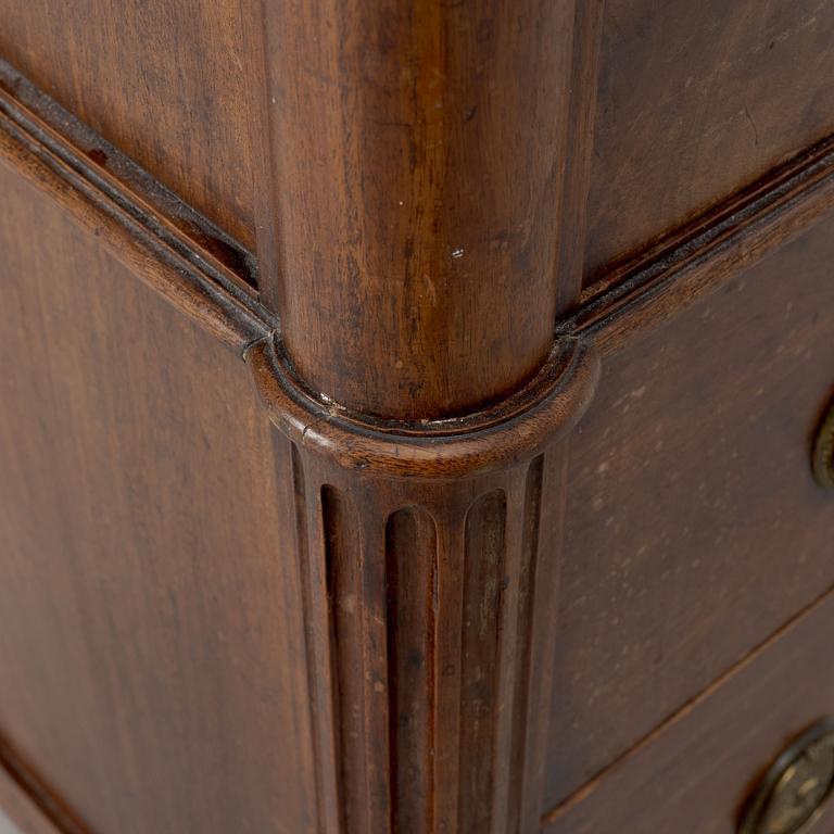 A Franch Directoire mahogany and marble commode, late 18th century.