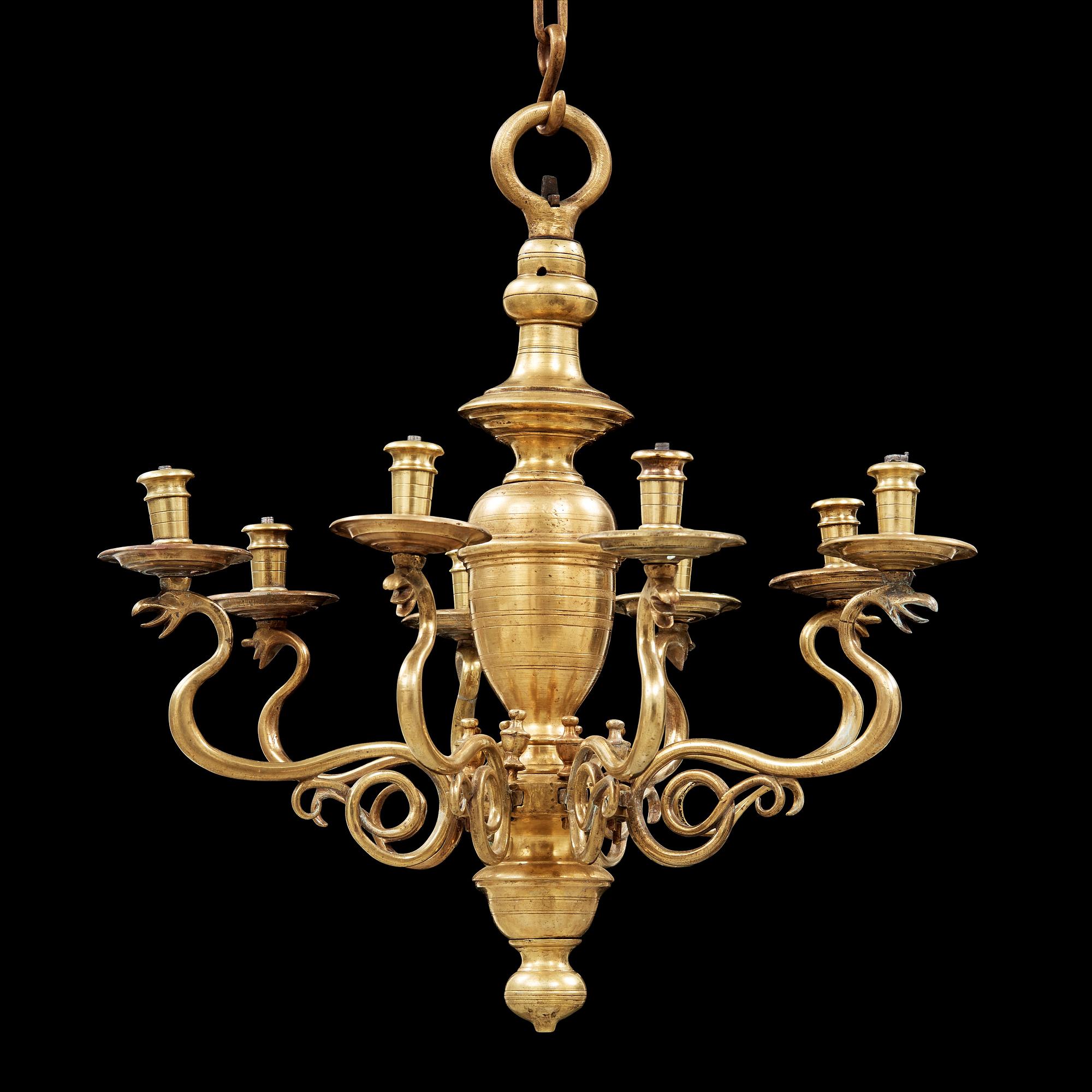 A 19th century eight-light brass chandelier in the manner of Hans Rogiers van Harelbeke.