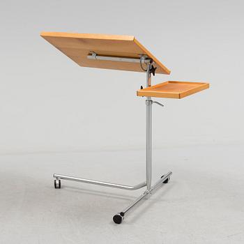 A teak reading table, second half of the 20th Century.