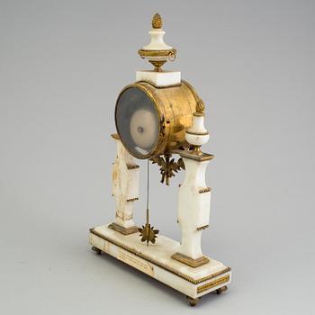 A Louis XVI marble and bronze mantel clock from the second half of the 18th century.